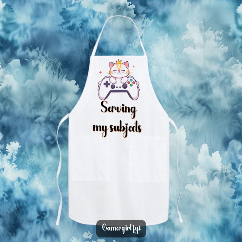 Funny apron showcasing a stylish cat wearing a crown, lounging on a huge gaming controller. Kitchen apparel for gamers.